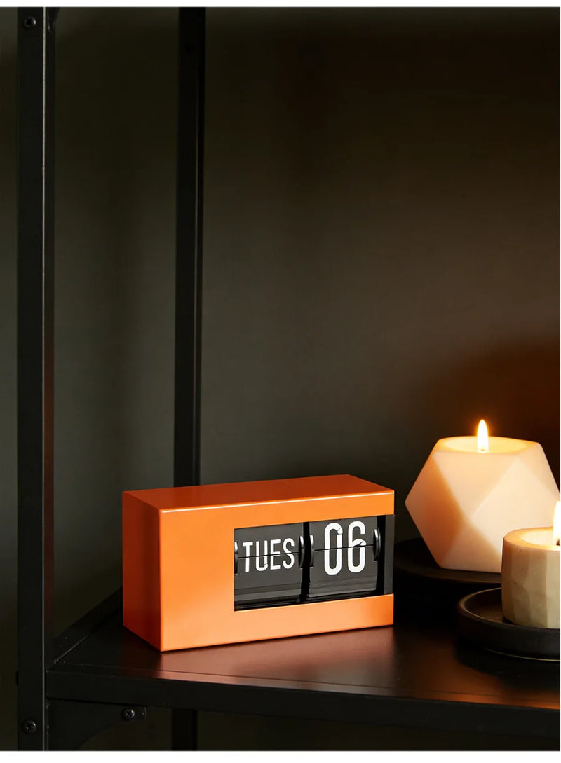 The Perpetual Executive Calendar Clock
Minimalist Flip Timepiece with Integrated Date Display